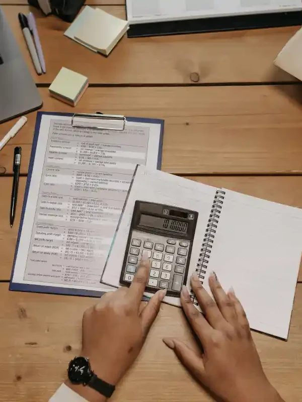 person organizing finances using simple systems for clarity and control